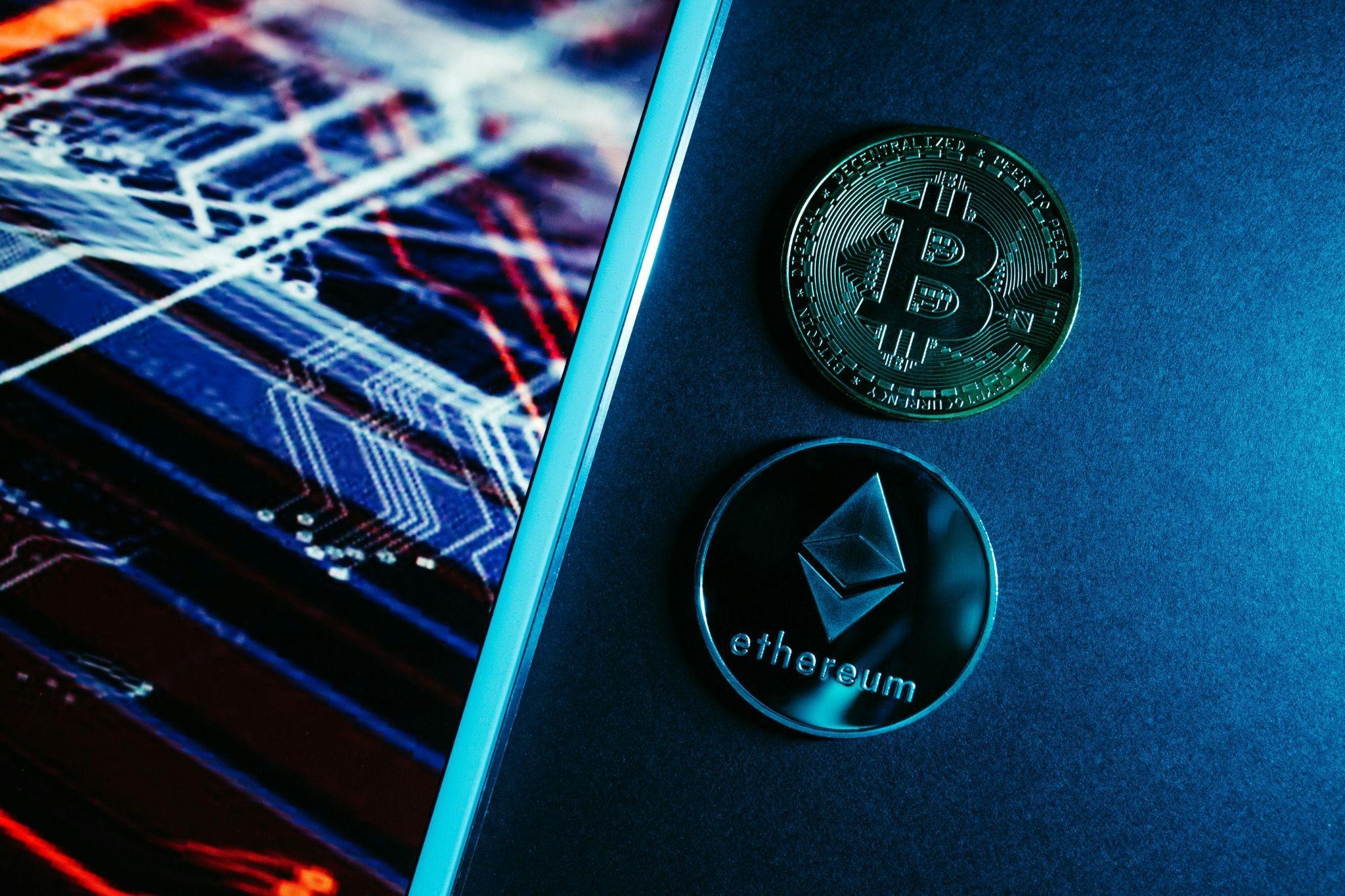 Bitcoin and Ethereum coins on a smartphone